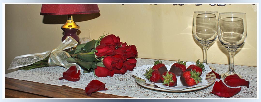 Roses and chocolate dipped strawberries add romance